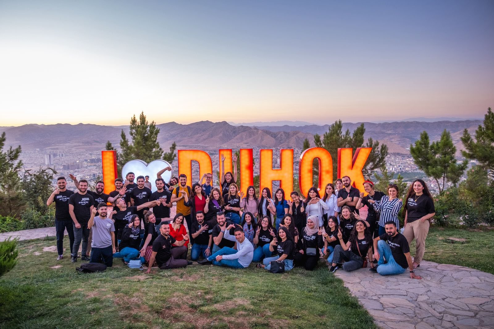 Participants celebrating together at Peace Camp 2022 while holding certificates
