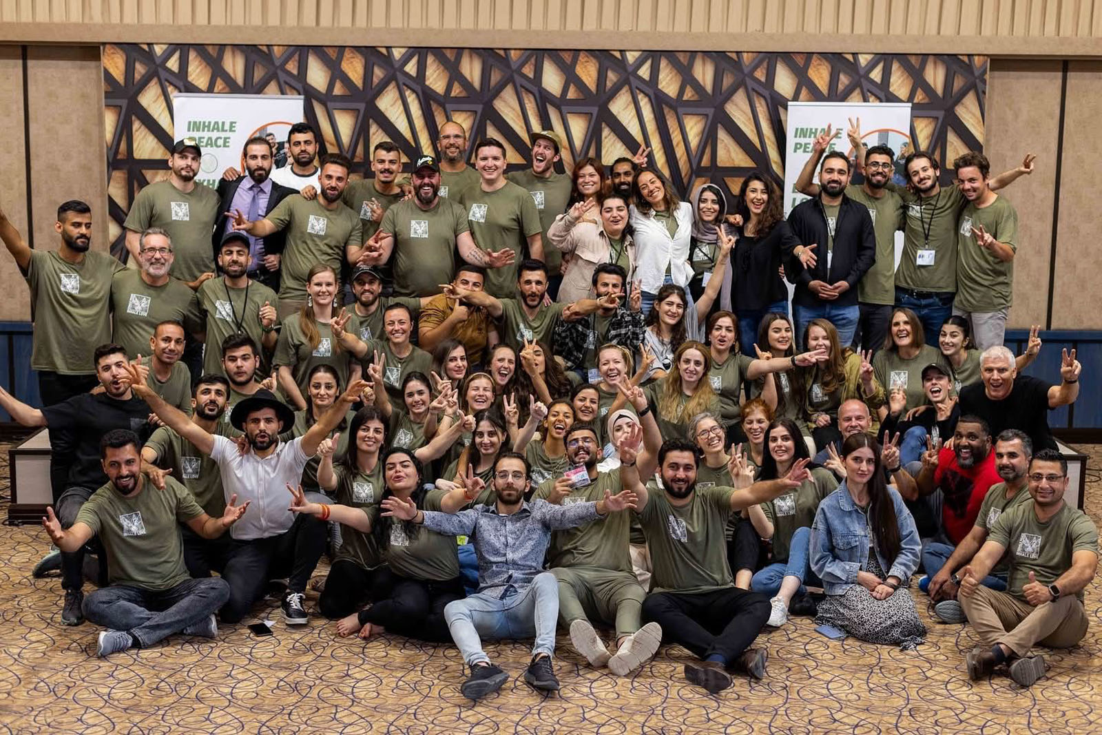 Participants gathered together during Peace Camp 2023 in a group photo indoors